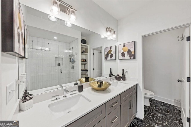 701 Pryor St SW # 5, Atlanta, GA 30315 - full bath with a shower stall, toilet, double vanity, and tile patterned flooring