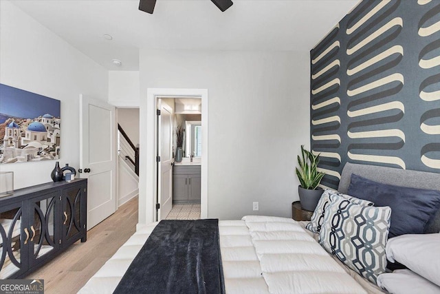 701 Pryor St SW # 5, Atlanta, GA 30315 - bedroom with light wood finished floors, ensuite bath, a ceiling fan, and a sink