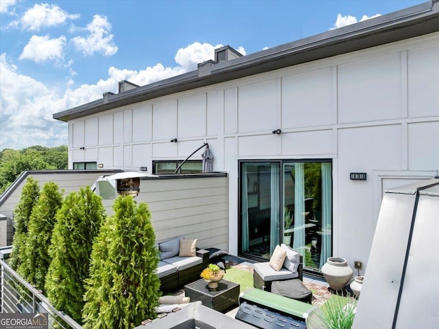701 Pryor St SW # 5, Atlanta, GA 30315 - rear view of property with outdoor lounge area and board and batten siding