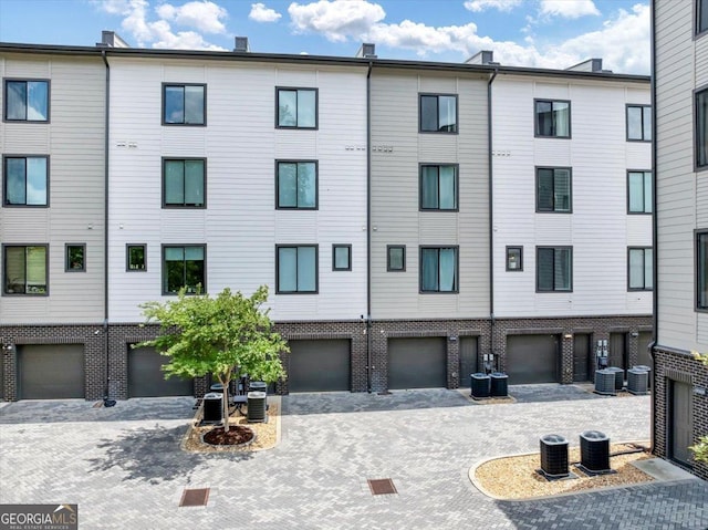 701 Pryor St SW # 5, Atlanta, GA 30315 - view of property featuring central air condition unit and a garage