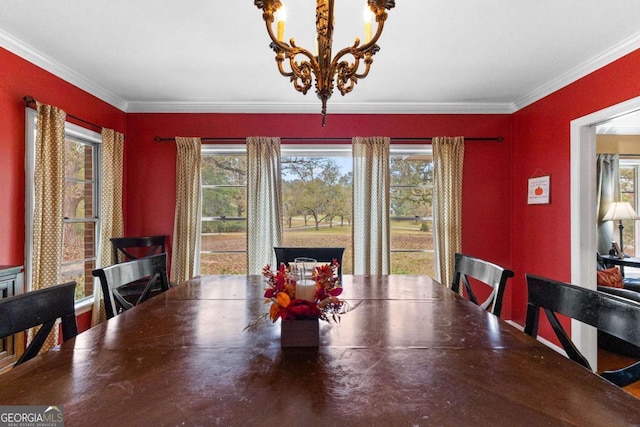 dining space with a chandelier, plenty of natural light, and crown molding