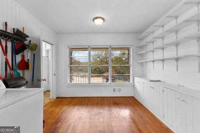 laundry area featuring light wood-style floors and washer / clothes dryer
