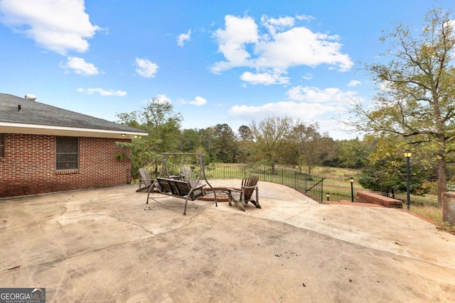 view of patio / terrace featuring fence
