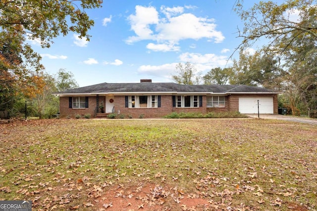 single story home with a garage, brick siding, a front lawn, and a chimney