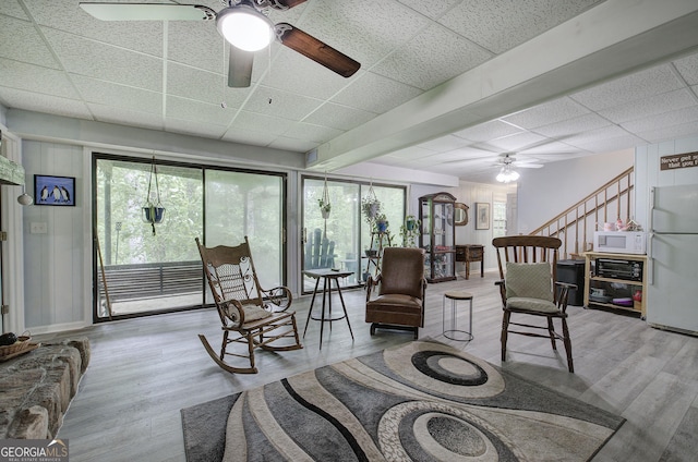567 Fred Kelley Rd NE, Rome, GA 30161 - living area featuring a paneled ceiling, ceiling fan, wood finished floors, plenty of natural light, and stairs