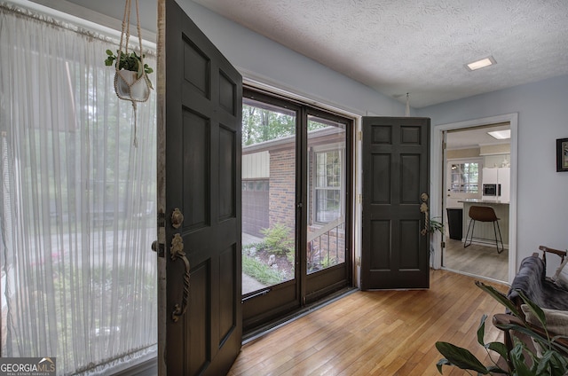 567 Fred Kelley Rd NE, Rome, GA 30161 - doorway to outside with light wood-type flooring and a textured ceiling