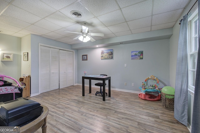 567 Fred Kelley Rd NE, Rome, GA 30161 - game room with wood finished floors, ceiling fan, a drop ceiling, and baseboards