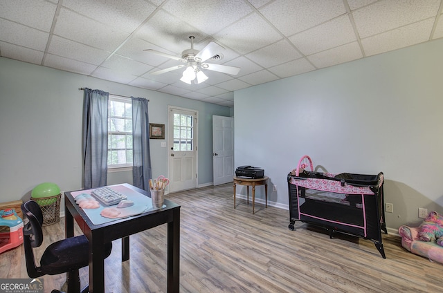 567 Fred Kelley Rd NE, Rome, GA 30161 - office space with a ceiling fan, wood finished floors, a drop ceiling, and baseboards