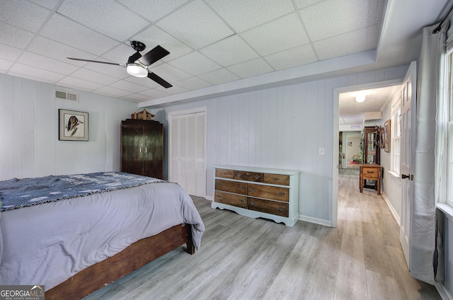567 Fred Kelley Rd NE, Rome, GA 30161 - bedroom with wood finished floors, a ceiling fan, baseboards, a closet, and a paneled ceiling