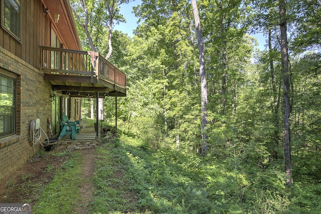 567 Fred Kelley Rd NE, Rome, GA 30161 - view of yard with a wooden deck and a wooded view