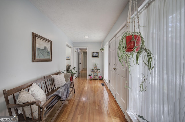 567 Fred Kelley Rd NE, Rome, GA 30161 - hall with light wood-style floors and a textured ceiling