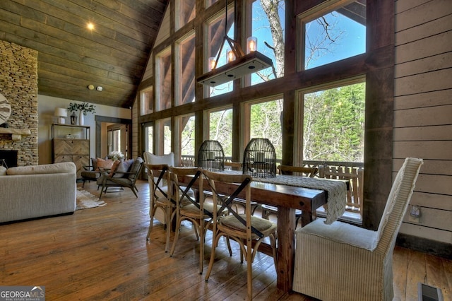 455 Misty Mountain Trl, Morganton, GA 30560 - dining area with high vaulted ceiling, hardwood / wood-style floors, a fireplace, and wooden ceiling
