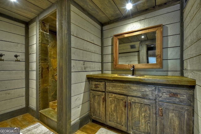 455 Misty Mountain Trl, Morganton, GA 30560 - bathroom with wood walls, wood finished floors, and vanity