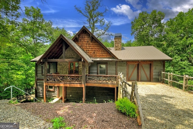 455 Misty Mountain Trl, Morganton, GA 30560 - rear view of house with a chimney, metal roof, fence, and a deck