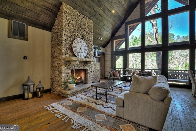 455 Misty Mountain Trl, Morganton, GA 30560 - living area with high vaulted ceiling, wooden ceiling, wood-type flooring, a fireplace, and baseboards
