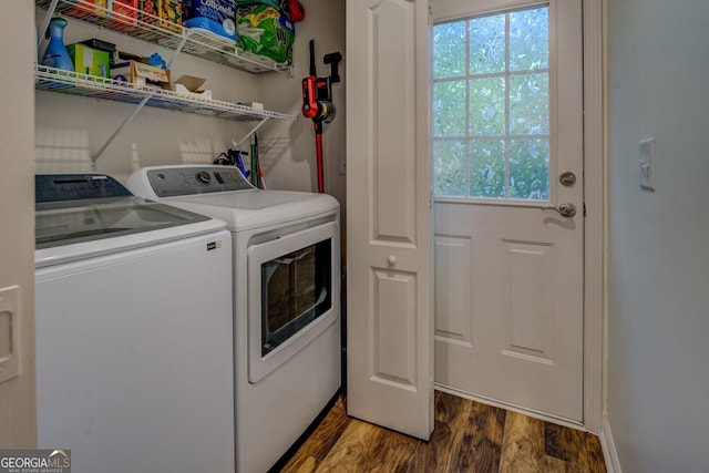 clothes washing area featuring independent washer and dryer, dark wood-style floors, and healthy amount of natural light