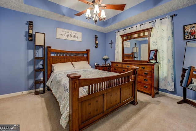 bedroom with light colored carpet, baseboards, and ceiling fan