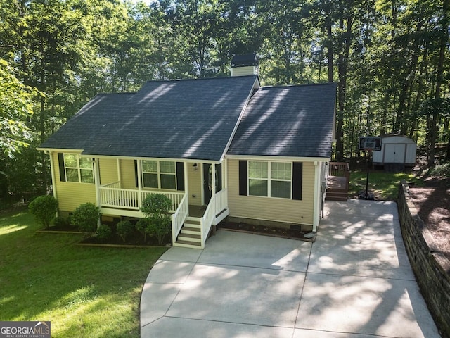 view of front of property with a storage shed, crawl space, a porch, and a chimney