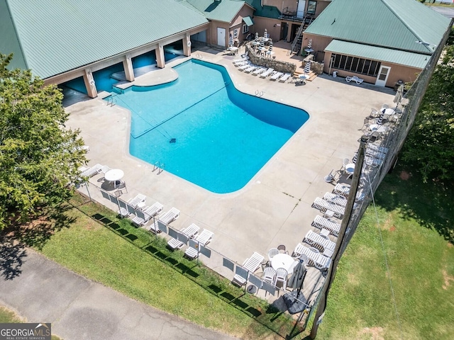 community pool featuring a patio area