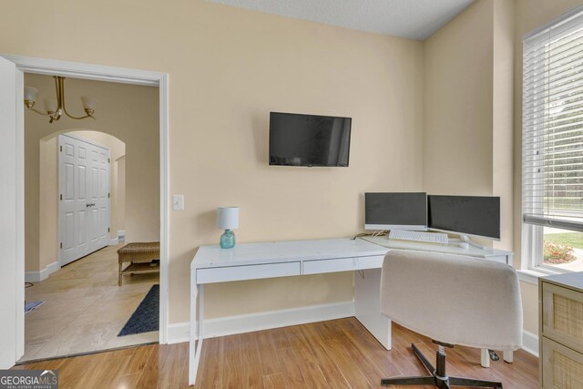 506 Hide Away Lake Loop, Kingsland, GA 31548 - office space featuring arched walkways, baseboards, and wood finished floors