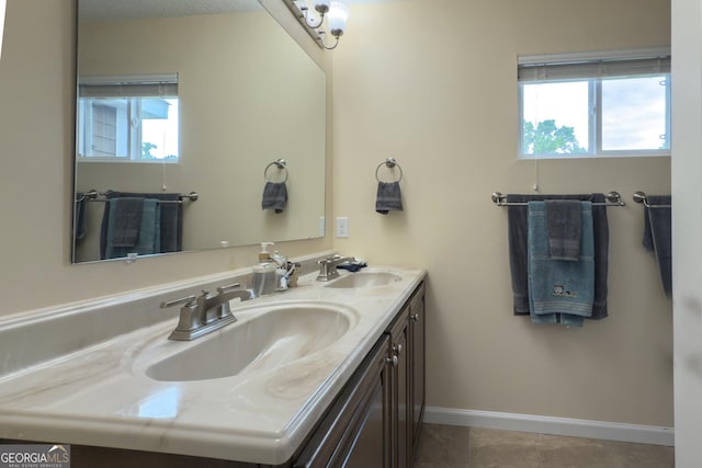 506 Hide Away Lake Loop, Kingsland, GA 31548 - bathroom with healthy amount of natural light, baseboards, and double vanity