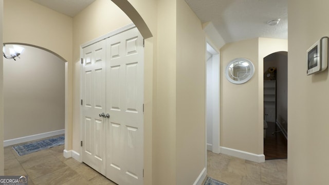 506 Hide Away Lake Loop, Kingsland, GA 31548 - hallway with arched walkways and baseboards