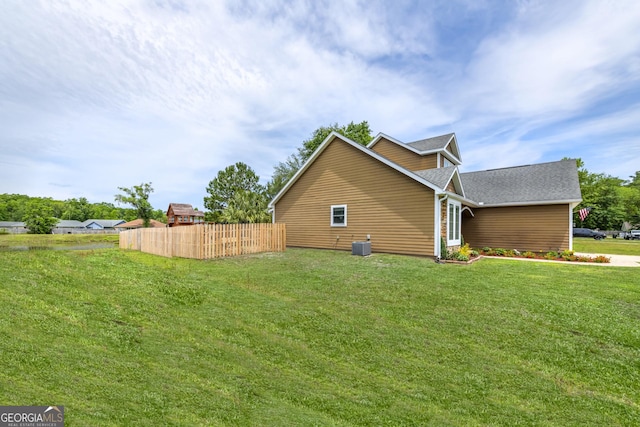 506 Hide Away Lake Loop, Kingsland, GA 31548 - view of side of home with central AC unit and a shingled roof