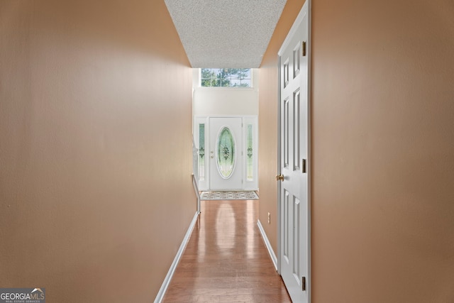 96 Ashtonbrook Dr, Mcdonough, GA 30252 - hall with baseboards, wood finished floors, and a textured ceiling