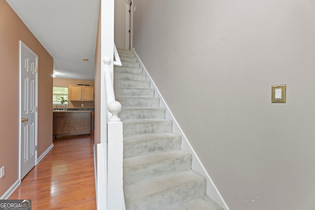 96 Ashtonbrook Dr, Mcdonough, GA 30252 - staircase featuring wood finished floors and baseboards