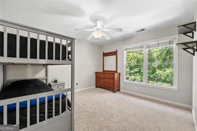 5652 Harbormist Dr, Powder Springs, GA 30127 - carpeted bedroom with baseboards and a ceiling fan