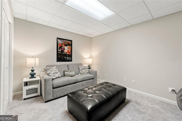5652 Harbormist Dr, Powder Springs, GA 30127 - carpeted living room featuring a drop ceiling and baseboards