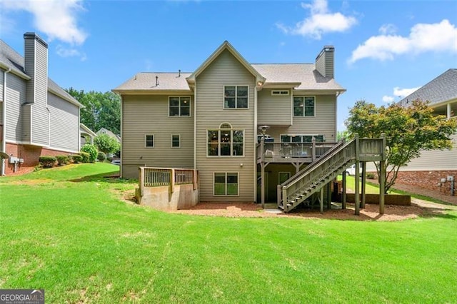 5652 Harbormist Dr, Powder Springs, GA 30127 - back of property featuring a wooden deck, stairway, a lawn, and a chimney