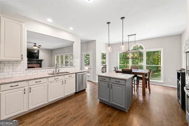 5652 Harbormist Dr, Powder Springs, GA 30127 - kitchen with dishwasher, a sink, gray cabinetry, tasteful backsplash, and white cabinets