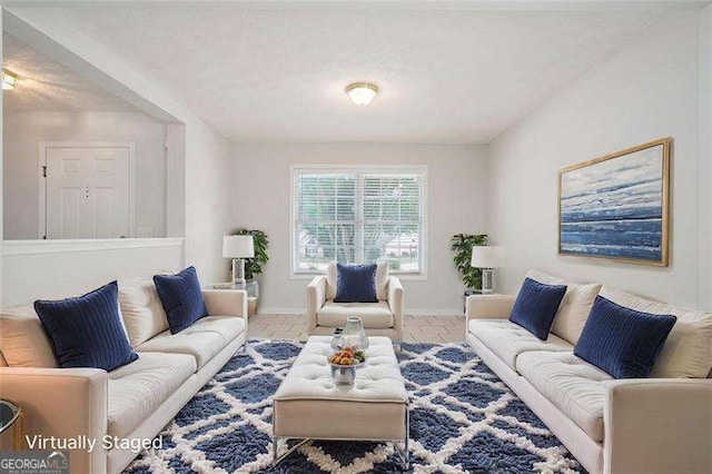 living room featuring baseboards