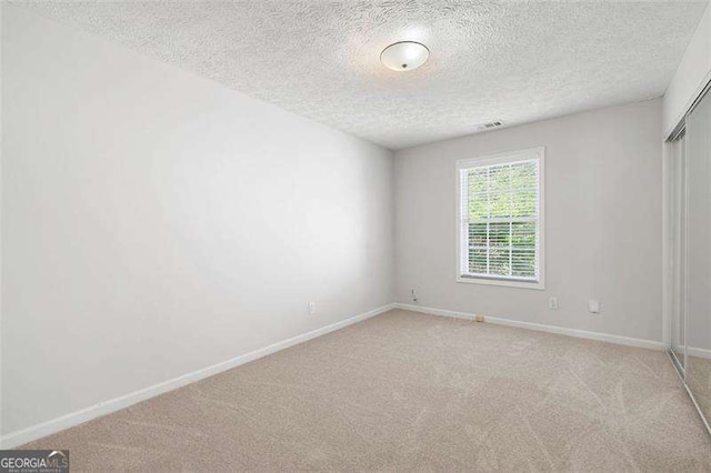 45 Waterloo Ct, Hiram, GA 30141 - spare room featuring light colored carpet and a textured ceiling