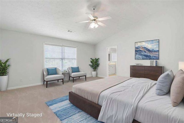 45 Waterloo Ct, Hiram, GA 30141 - carpeted bedroom featuring vaulted ceiling, connected bathroom, a ceiling fan, and a textured ceiling