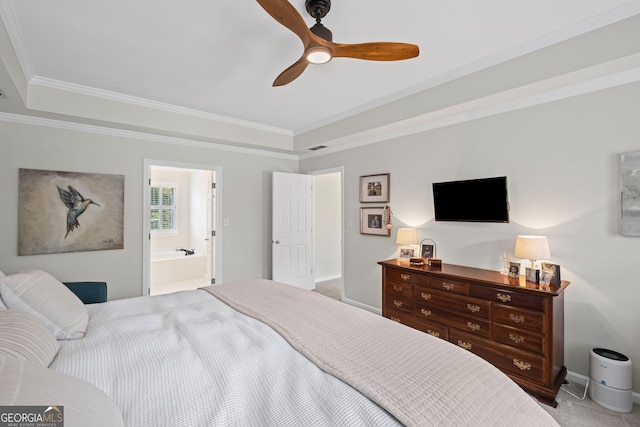 bedroom featuring carpet, baseboards, crown molding, ceiling fan, and connected bathroom
