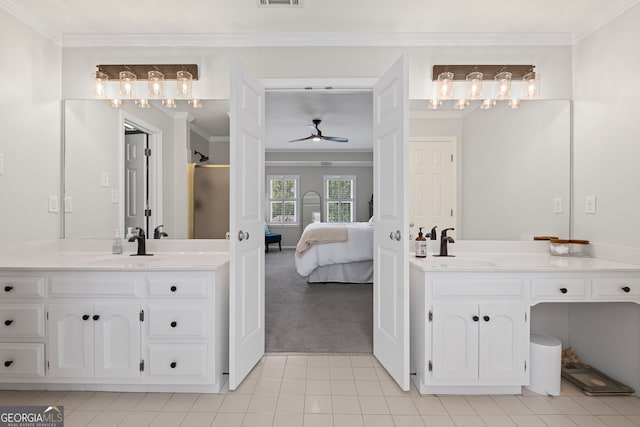 full bathroom featuring ensuite bathroom, ceiling fan, crown molding, tile patterned floors, and two vanities