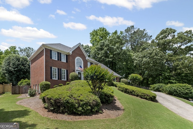 view of front of house featuring brick siding