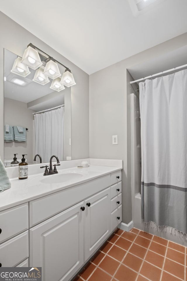 bathroom featuring vanity, tile patterned floors, and shower / bath combination with curtain