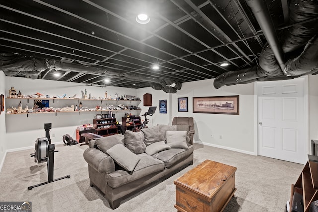 living area featuring carpet and baseboards
