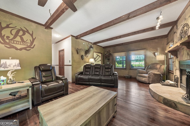 living area with beam ceiling, dark wood-style flooring, ceiling fan, and crown molding