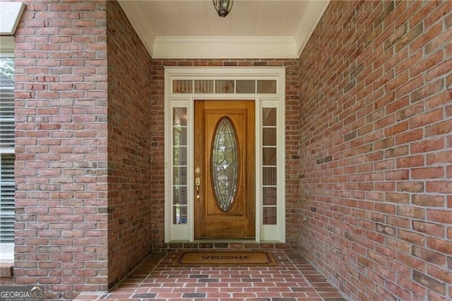 property entrance with brick siding