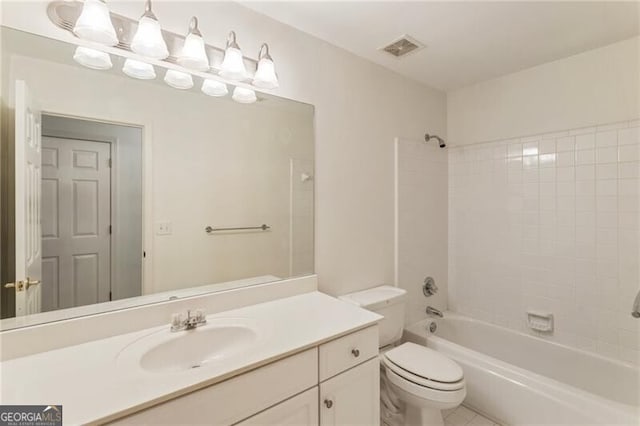bathroom with toilet, vanity, shower / washtub combination, and tile patterned flooring