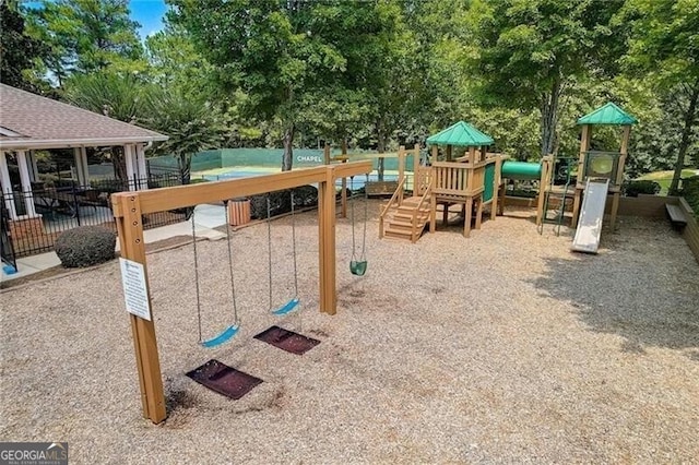 community jungle gym featuring view of scattered trees
