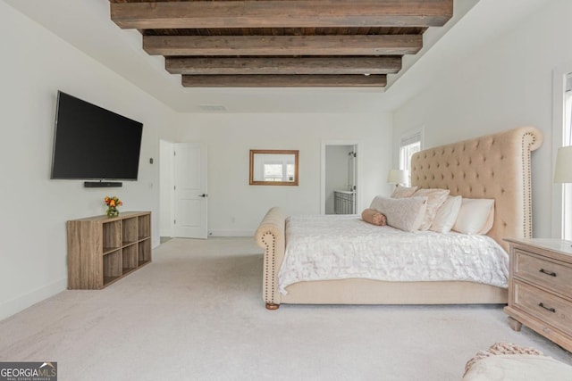 bedroom featuring beamed ceiling, baseboards, and light colored carpet