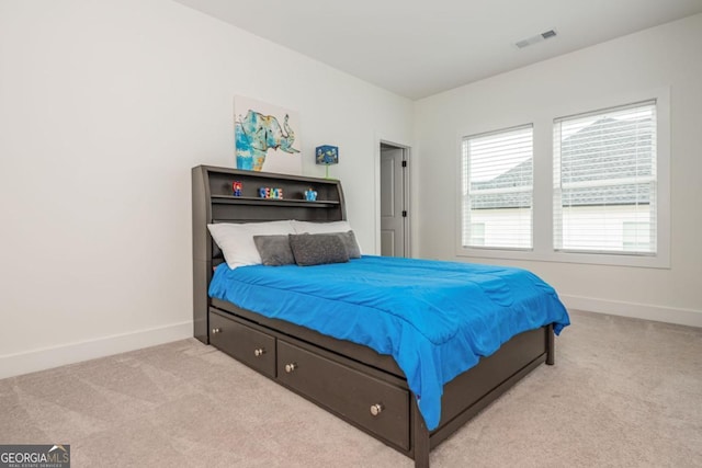 bedroom with carpet floors and baseboards