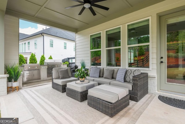 view of patio featuring ceiling fan, an outdoor living space, grilling area, and an outdoor kitchen