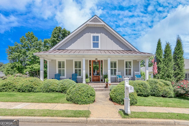 131 Village Dr, Clarkesville, GA 30523 - bungalow featuring covered porch, board and batten siding, a standing seam roof, and metal roof