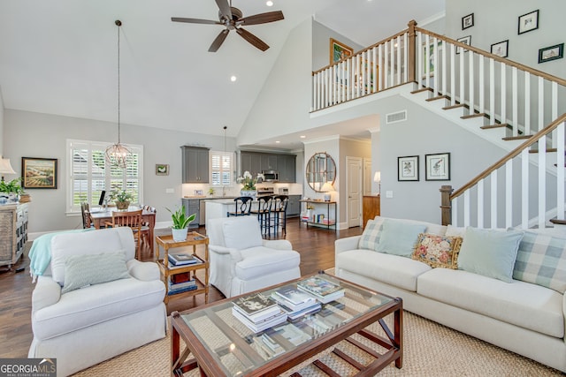 131 Village Dr, Clarkesville, GA 30523 - living area featuring high vaulted ceiling, ceiling fan, wood finished floors, stairway, and recessed lighting